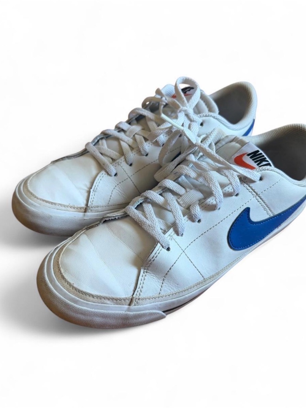 Nike Kids White Sneakers with Blue Swoosh and Orange Logo